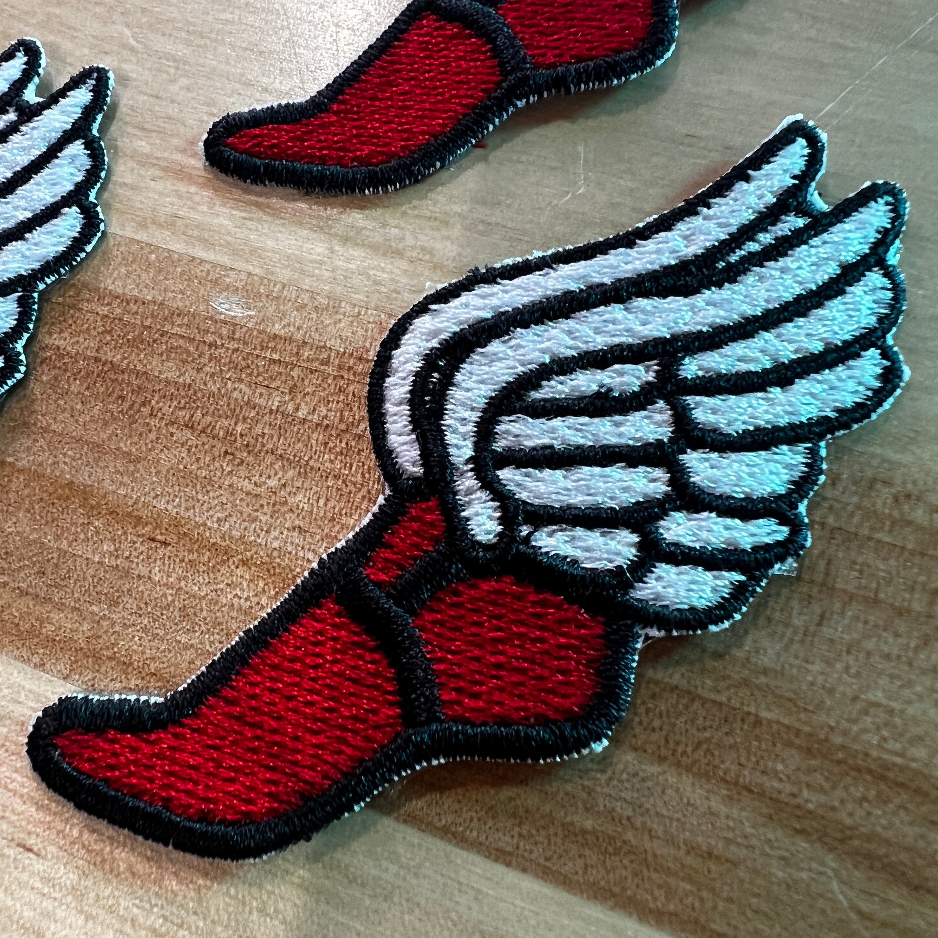 Iron on Winged Track Feet Embroidery Patches (4 Pack)